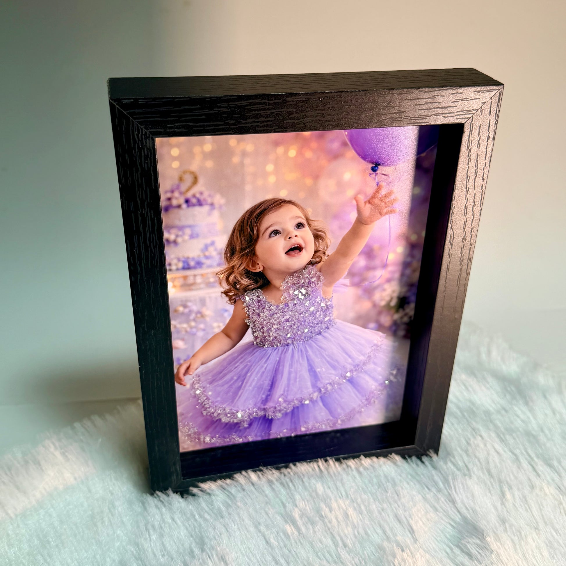 Custom glitter photo frame with personalized portrait print - standing display view, elegant black wood frame
